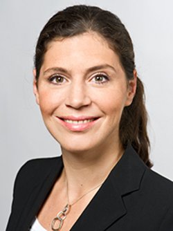 prof hana milanov wearing a black blazer smiling