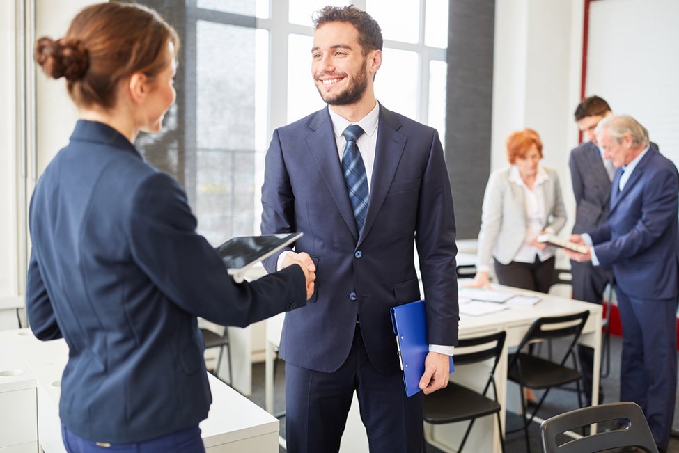 Business partners shake hands