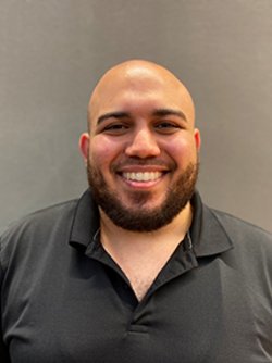 A man with beard smiling 