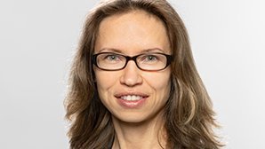Headshot of Prof. Dr. Svetlana Ikonnikova , a middle age woman smiling on a simple white  background.