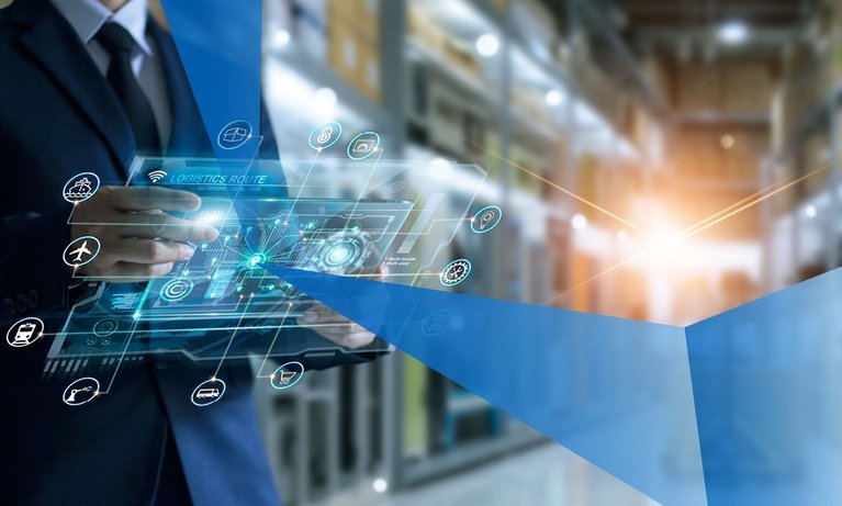 Businessman holding virtual interface panel in a large warehouse center