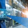 Businessman holding virtual interface panel of global logistics network distribution and transportation, Smart logistics, Innovation future of transport on large warehouse center background