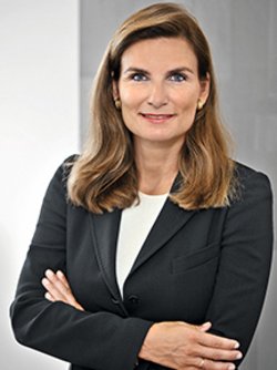 prof ann kristin wearing black blazer smiling