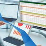 Rear view of woman financial specialist studying theory and practice blockchain technology. 