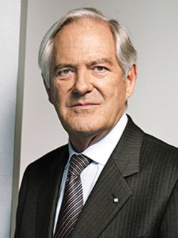 roland berger wearing a black blazer smiling 