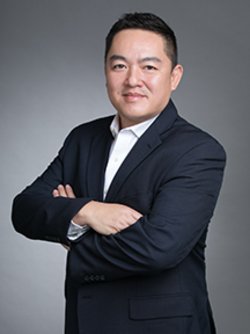 vu huy nguyen wearing a white shirt and blue blazer smiling