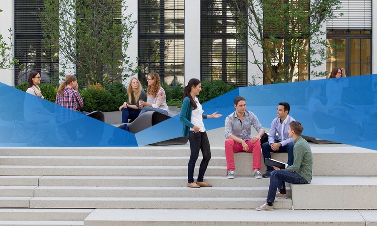 Students standing and sitting in front of the TUM School of Management chatting