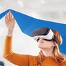 Female student put on vr glasses into virtual simulated world