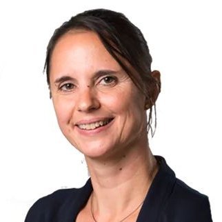 Headshot of Prof. Mirjam-knockaert, a middle aged woman smiling on a simple white background.