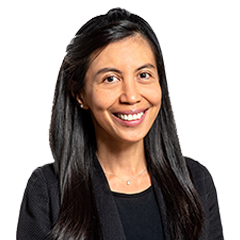 Headshot of Bhenaline Milaham, a middle age woman smiling on a simple light white background.