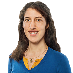 Headshot of Katja Lesske, a young woman smiling on a simple white background.