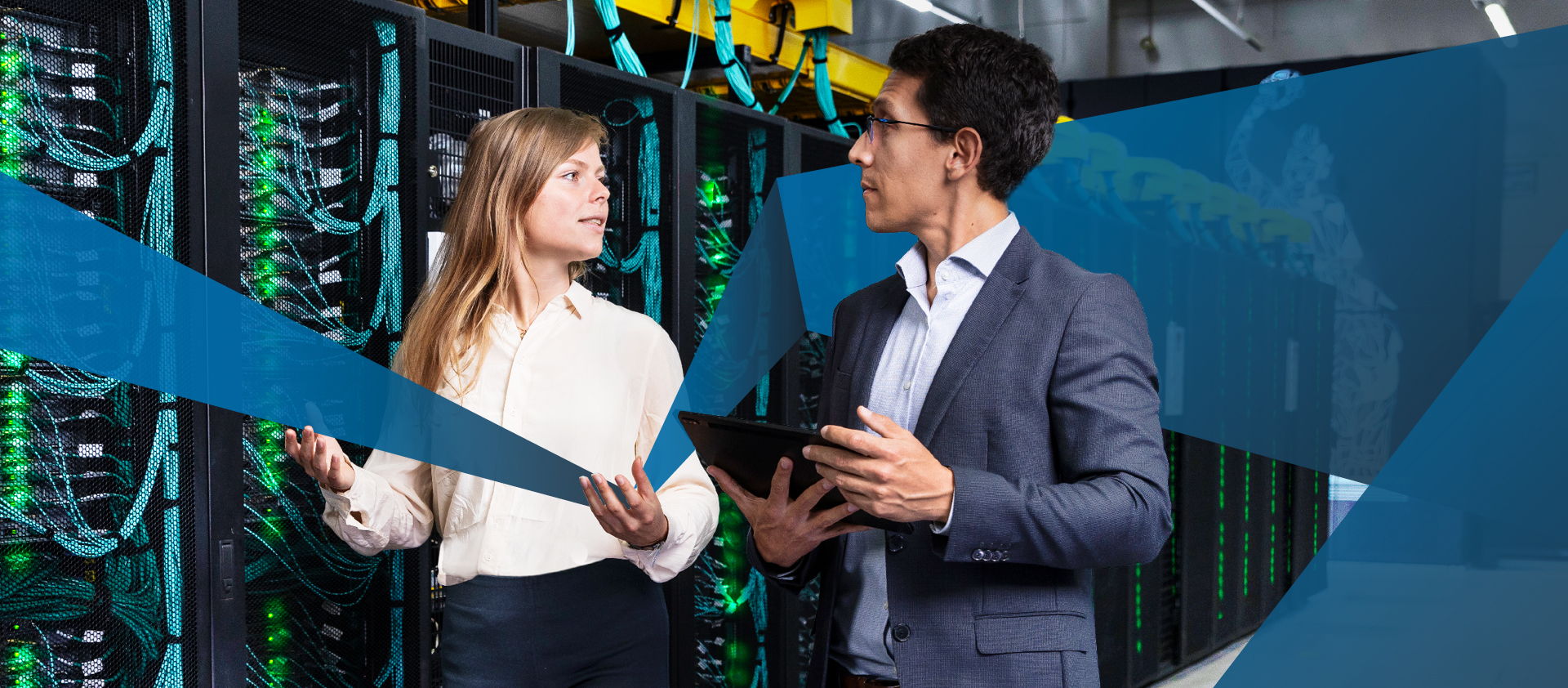 Female and male business colleagues inspecting internet database servers at computer security