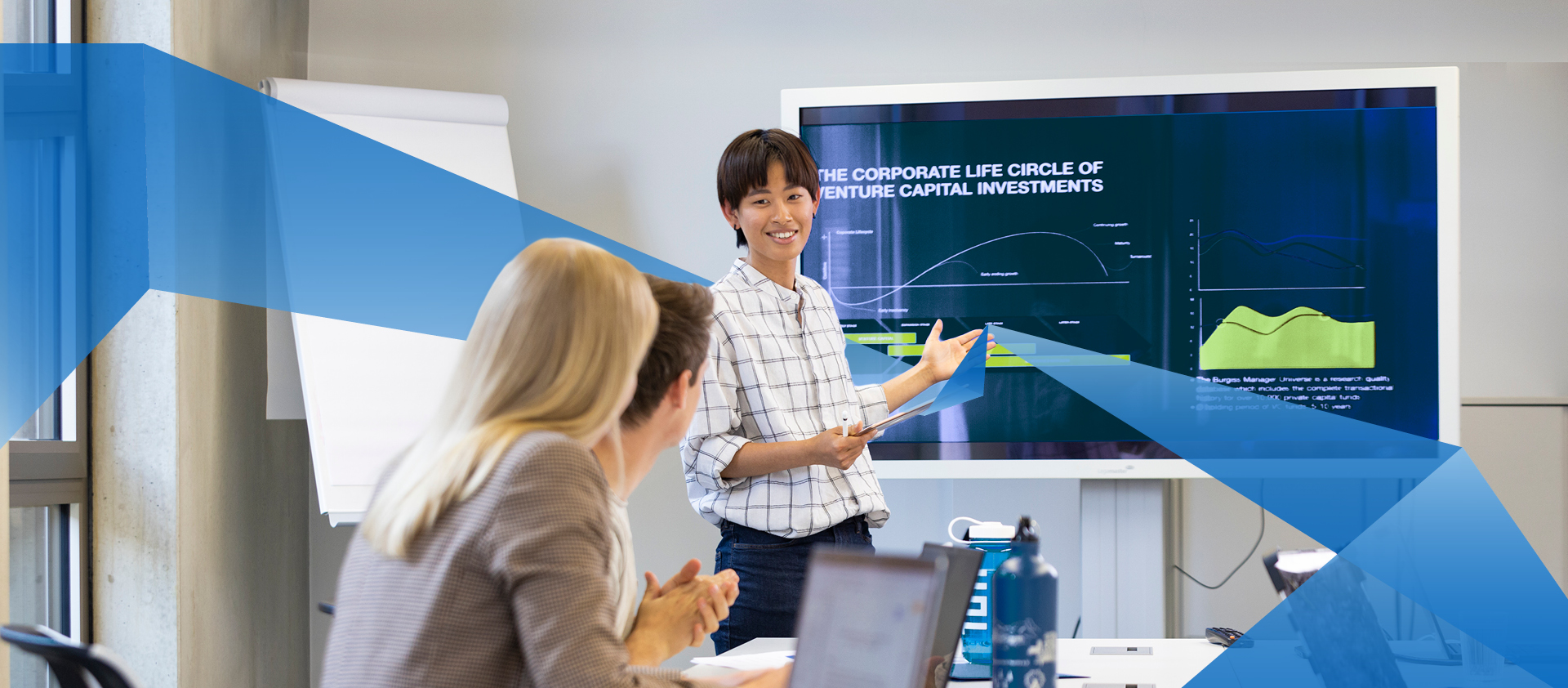 Female asian FIM student presents something to her fellow students via powerpoint