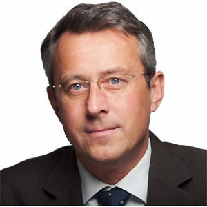 Headshot of Prof. Dr. Hubert Röder, a middle age man smiling on a simple white  background.