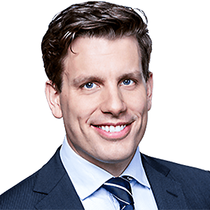 Headshot of Prof. Dr. Reiner Braun, a middle age man smiling on a simple white background.