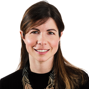 Headshot of Prof. Dr Melanie Richard, a middle aged woman smiling on a simple grey background.