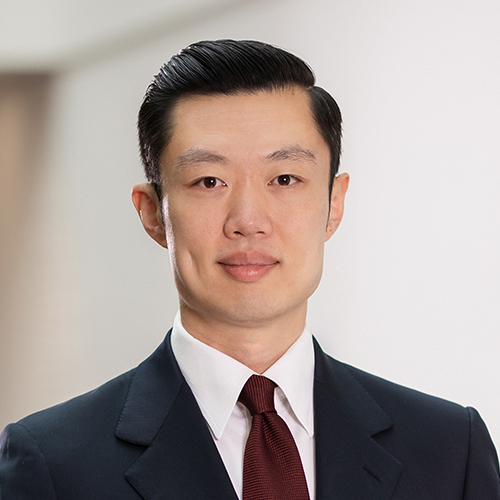Asian smiling man in a suit 