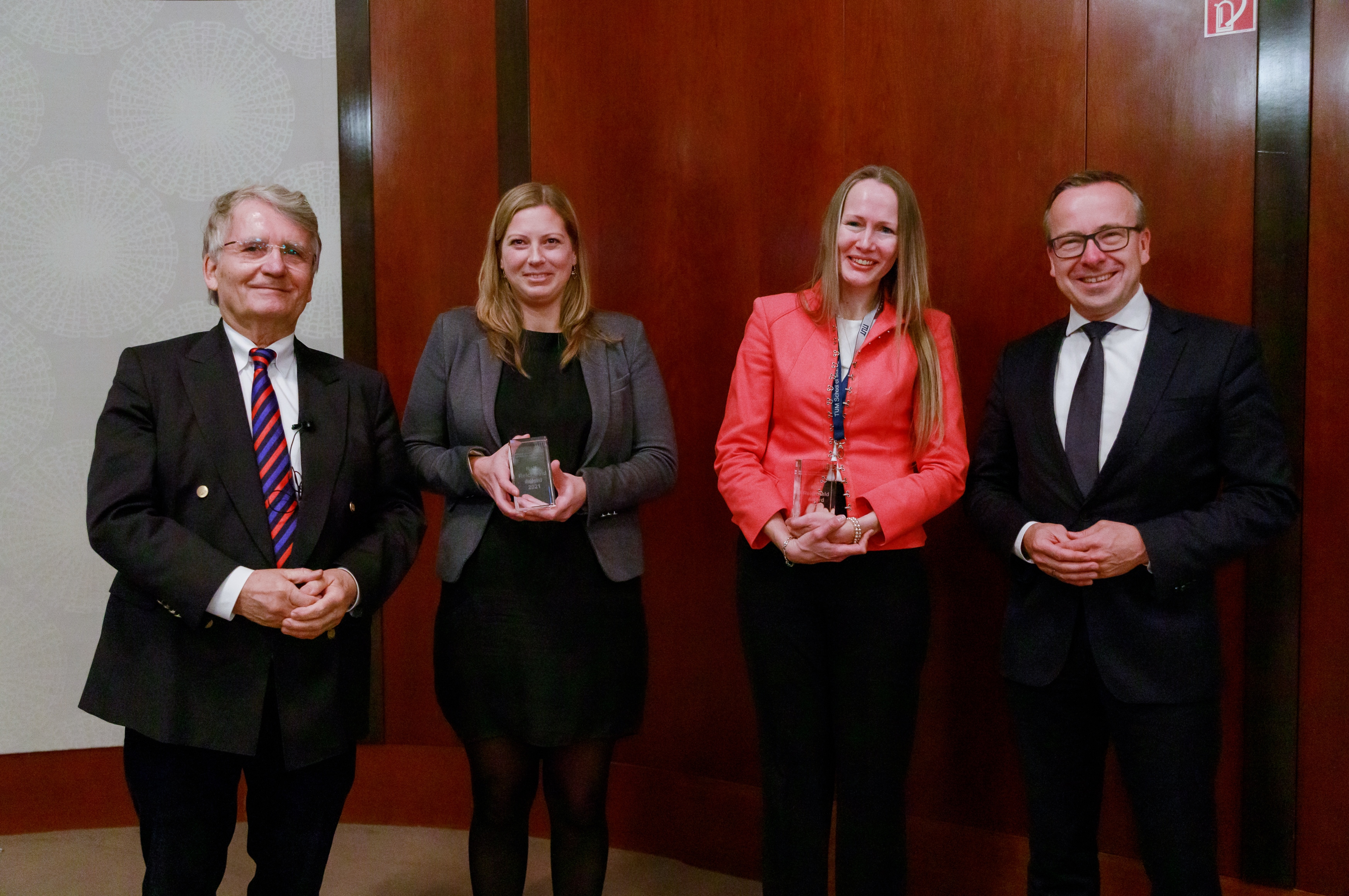 from left to right: Prof. Ralf Reichwald, Katinka Kleinheinz who accepted the award on behalf of Sabrina Huber, Tanya Göttinger, and Prof. Dr. Gunther Friedl.
